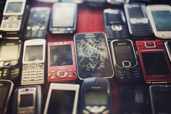 broken cracked cell phones at an electronics waste collector | e-waste solutions