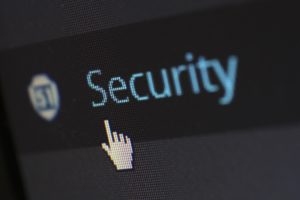A Computer Scren of an IT Team Member Showing "Security" Written on the Screen