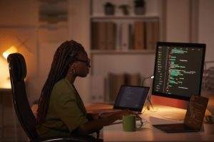 Woman Coding on New Computer Software